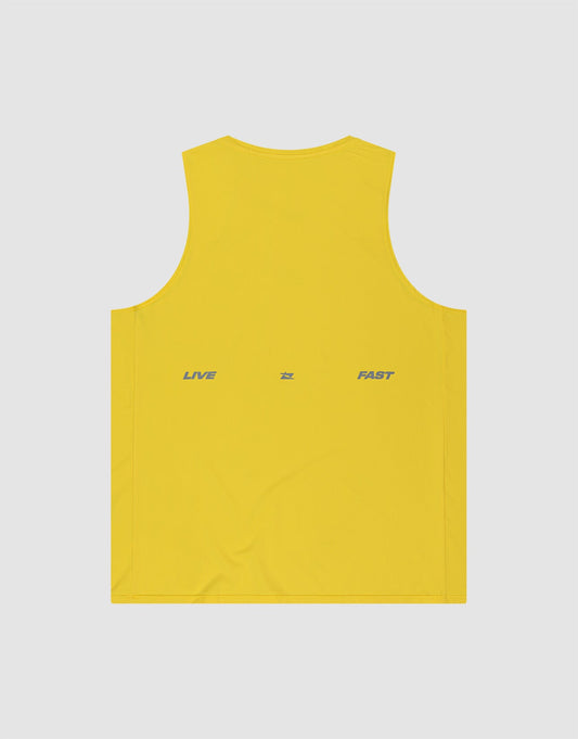 The LIVE FAST DIE YOUNG Live Fast Performance Tank is a yellow sleeveless slim fit top in nylon spandex, featuring "LIVE" and "FAST" printed in gray on the back with a small gray symbol, set against a light gray background.