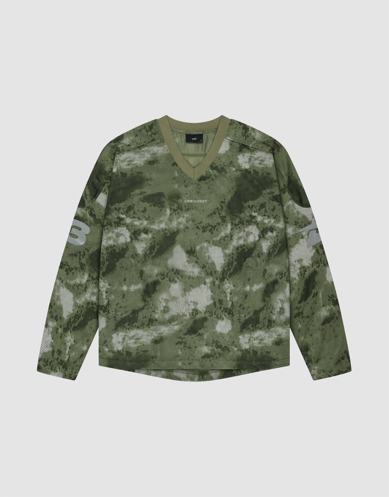 The LIVE FAST DIE YOUNG Camo Mesh Jersey is an oversized, long-sleeve V-neck shirt in green camo, with the number 3 on each sleeve and a small reflective LIVE FAST print on the chest. It is shown laid flat on a light background.
