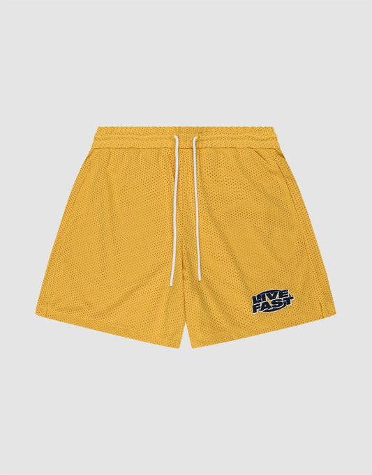 LIVE FAST DIE YOUNG LFDY Oval Mesh Shorts in yellow polyester feature a white drawstring, elastic waistband, and a black and white LIVE FAST graphic on the left leg. Shown on a plain light gray background. | plain