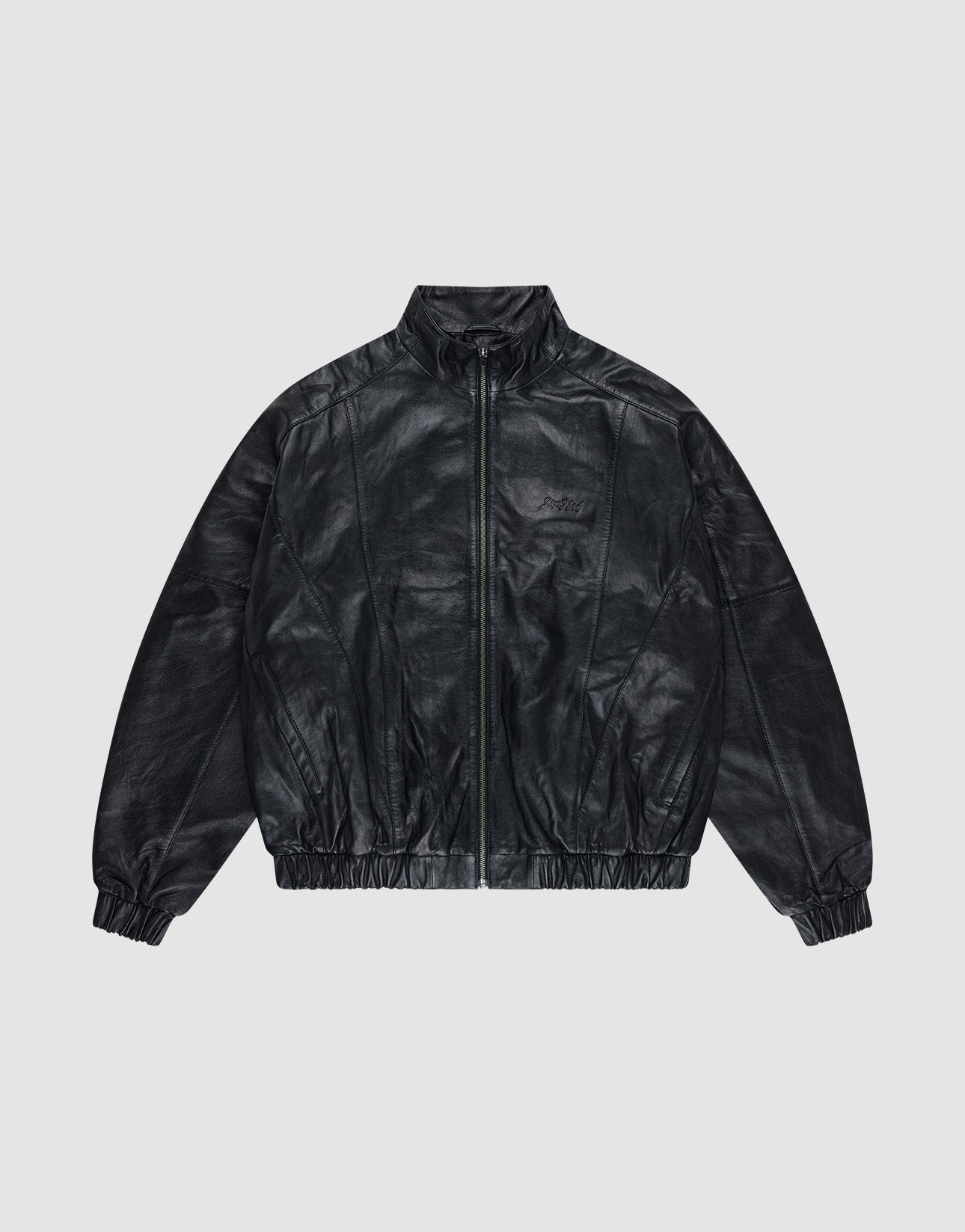 The Live Fast Leather Trackjacket by LIVE FAST DIE YOUNG is a black, zip-up, long-sleeve jacket with an embossed logo, Stehkragen, and elastic cuffs and waistband, shown on a plain light gray background. | plain