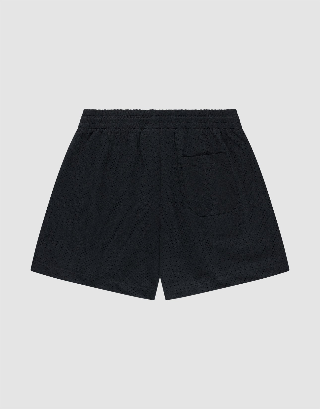 LIVE FAST DIE YOUNG Basic Mesh Shorts in black feature a regular fit, lightweight polyester fabric, elastic waistband, and single rectangular back pocket. Shown on a plain light gray background.