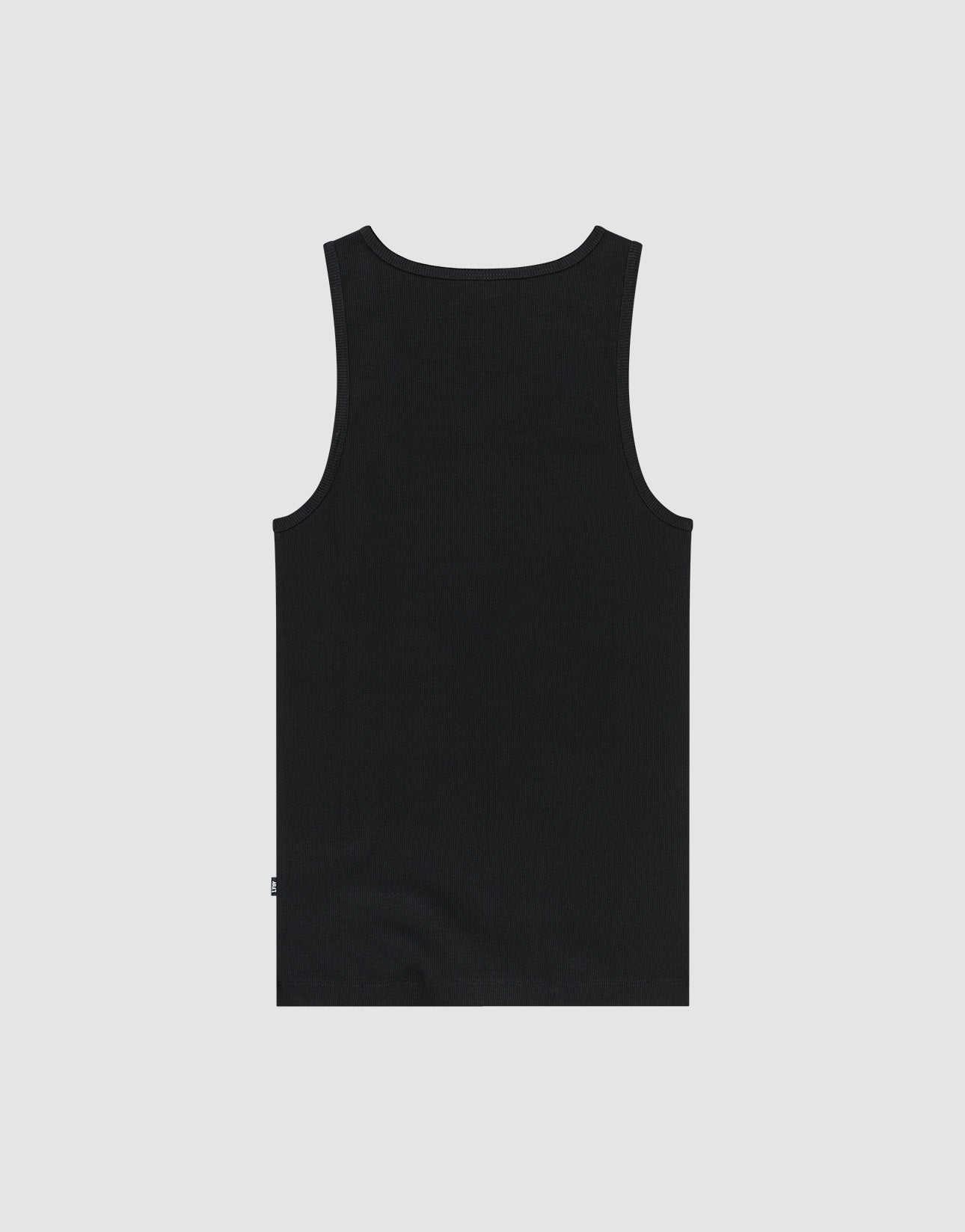 A man stands against a plain white background wearing the LIVE FAST DIE YOUNG Blank Rib Tank in black, paired with a white cap, black and gray athletic shorts, white socks, and white sneakers. He faces forward with a relaxed expression and posture.