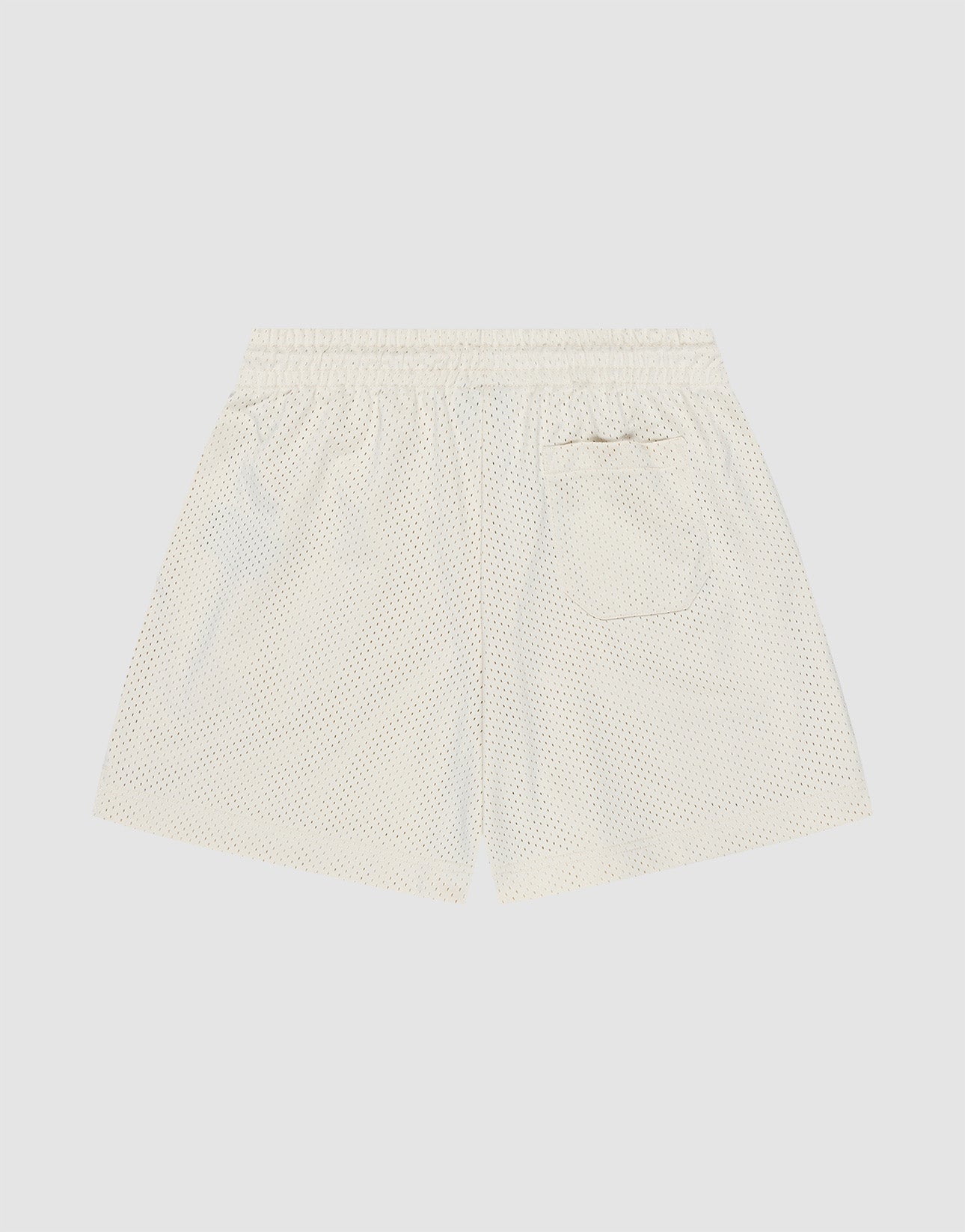 Back view of LIVE FAST DIE YOUNG Basic Mesh Shorts in white polyester mesh with an elastic waistband and a single patch pocket featuring a subtle logo patch, displayed on a plain light background.