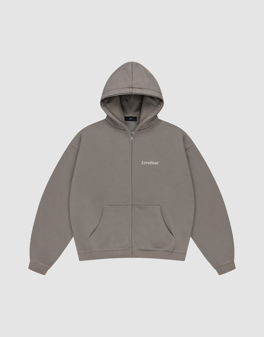 The Basic 510 Hooded Zip by LIVE FAST DIE YOUNG is a plain grey zip-up hoodie with a subtle vintage wash, front pockets, hood, and "LiveFast" in small white text on the left chest, shown flat on a light grey background.