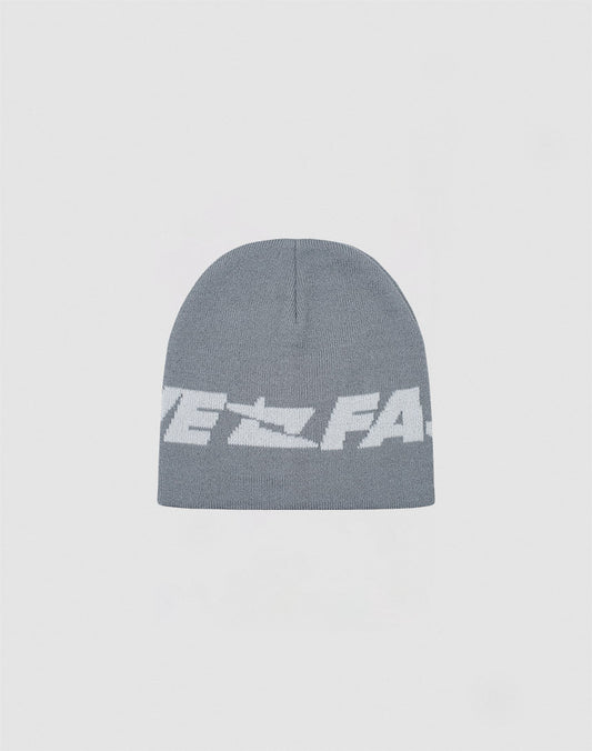 The Live Fast Jacquard Beanie by LIVE FAST DIE YOUNG is a soft gray polyacryl knit with a bold white Logo Strick graphic and partially visible text on the front. Model: LF2410-16486. 