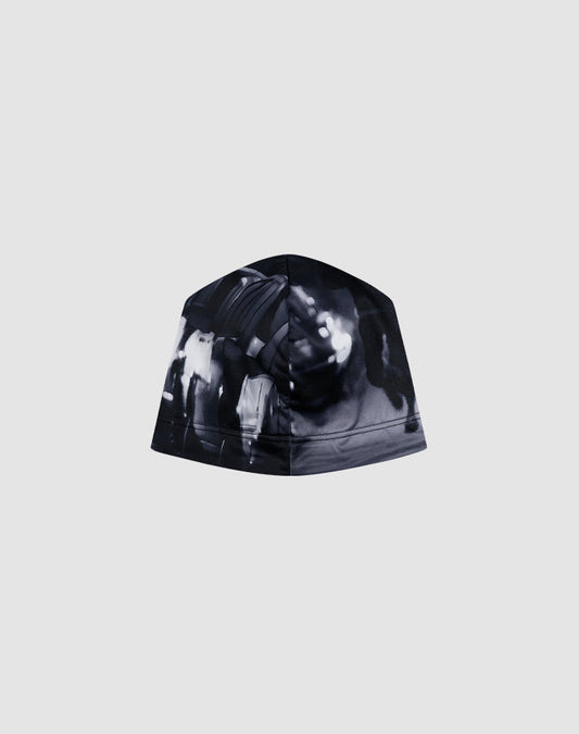 The LIVE FAST DIE YOUNG Live Fast Performance Beanie features a black and white abstract, blurred graphic print on a plain grey background.