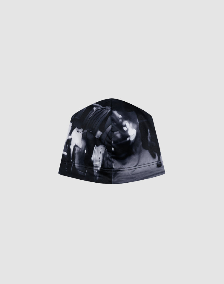 The LIVE FAST DIE YOUNG Live Fast Performance Beanie features a black and white abstract, blurred graphic print on a plain grey background.