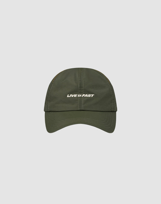 The LFDY Performance Cap by LIVE FAST DIE YOUNG is an olive green nylon cap with white LIVE FAST text on the front, geometric ventilation holes, and adjustable sizing, shown on a light gray background.