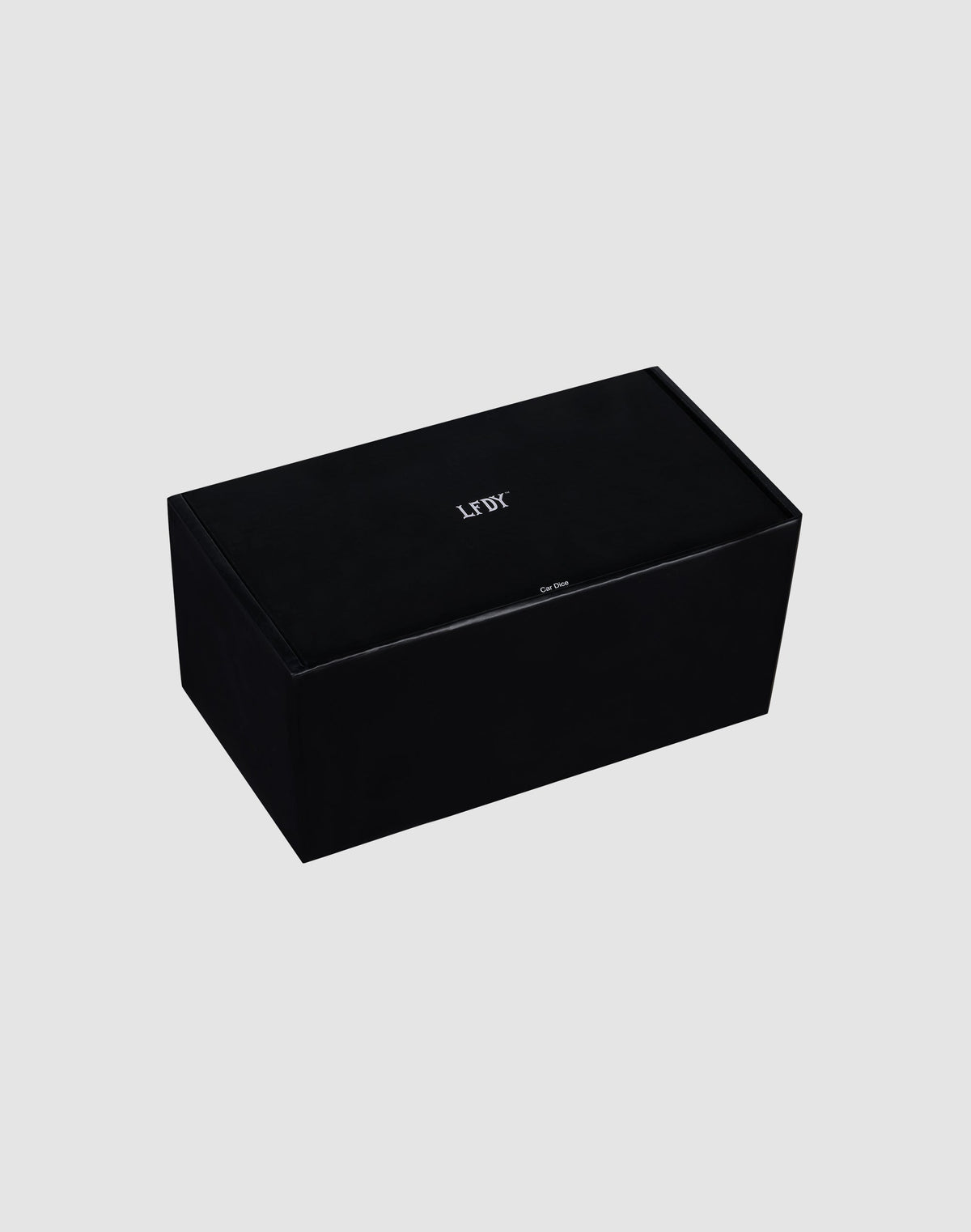 A rectangular black LFDY Leather Car Dice by LIVE FAST DIE YOUNG, featuring "LEFT" in white on top, displayed on a plain light gray background.