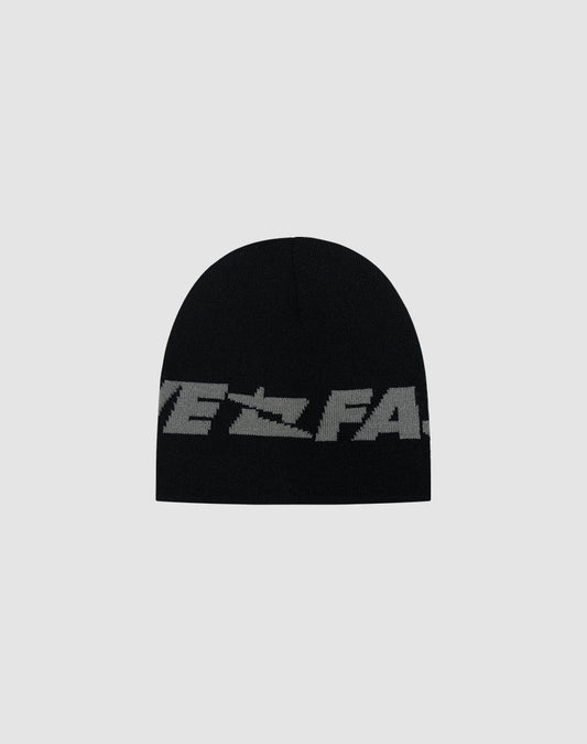 The Live Fast Jacquard Beanie by LIVE FAST DIE YOUNG is black with a bold gray Logo Strick text wrapping the lower edge, made from soft Polyacryl. Shown on a plain light gray background. Model: LF2504-17542.