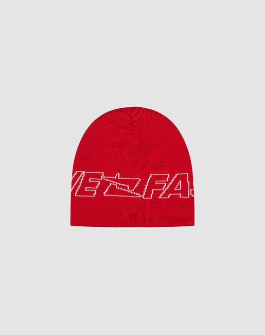 The Live Fast Jacquard Beanie by LIVE FAST DIE YOUNG is a red knit Polyacryl beanie with a white abstract logo and text design, partially reading VE FAS, shown on a light gray background. 