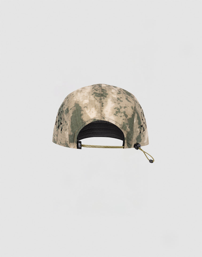 The Live Fast 5 Panel Cap by LIVE FAST DIE YOUNG is displayed from the back, showing its camouflage nylon fabric, side ventilation holes, and elastic closure. The background is plain and light-colored.