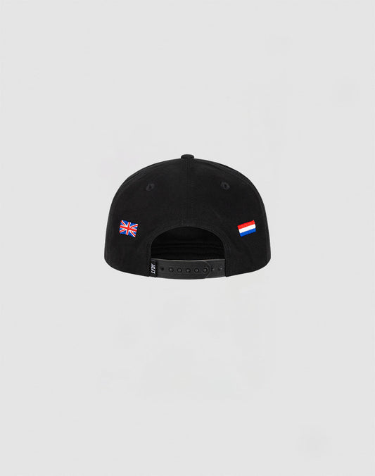The Live Fast Corporation Cap by LIVE FAST DIE YOUNG is a black, unstructured 5-panel 100% cotton cap featuring UK and Russian flags above the adjustable strap—a sleek multi-logo design viewed from the back.
